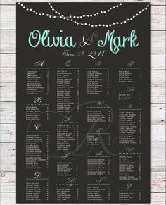 a black and white wedding seating chart with silver confetti