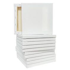 a stack of white boxes sitting next to each other on top of eachother