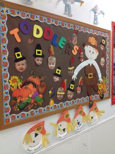 a bulletin board decorated with children's thanksgiving pictures