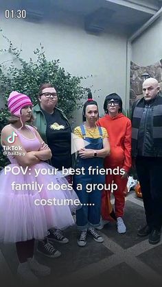 a group of people standing next to each other in front of a building with the caption pov your best friends family does a group costume