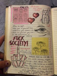 an open notebook with pictures and words on it, including the word f k society