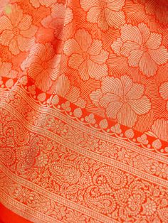 Experience the luxurious elegance of our Katan Silk Tanchoi Sarees, handcrafted with intricate Banarasi designs and premium Katan silk fabric. Available in a range of colors and styles, these sarees are the perfect choice for any special occasion Elegant Orange Katan Silk Dupatta, Elegant Orange Katan Silk Saree, Traditional Zari Weaving Silk Scarf For Weddings, Elegant Orange Zari Weaving Traditional Wear, Orange Blouse Piece With Traditional Patterns And Drape, Traditional Drape Silk Scarf With Zari Weaving For Weddings, Traditional Silk Scarf With Zari Weaving For Weddings, Diwali Pashmina Shawl Saree With Traditional Patterns, Orange Blouse Piece With Traditional Patterns