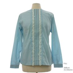 Early 60s "H Bar C California Ranchwear, Made in USA" Womens light blue background polyester cotton broadcloth with darker blue zigzag embroidery on center front panel with white lace and smocking, longsleeve Mod shirt with back zipper closure, round neckline, back shaped yoke, snap cuffs, square hemline with short side slits, deadstock with original tag Fits: 36Bust, 31.5Sleeve Our item # 367456-M63772 Fitted Light Blue Shirt For Spring, Light Blue Fitted Shirt For Spring, Light Blue Long Sleeve Cotton Blouse, Light Blue Long Sleeve Shirt For Daytime, Light Blue Long Sleeve Tops For Daywear, Light Blue Long Sleeve Blouse For Daywear, Blue Long Sleeve Ruffled Shirt, Fitted Light Blue Ruffled Blouse, Fitted Light Blue Top For Daywear