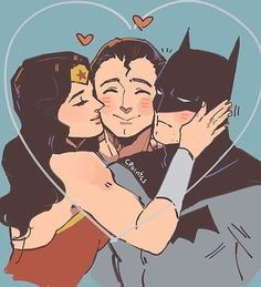 two people are hugging each other and one is wearing a batman mask while the other has his arm around another person's shoulder