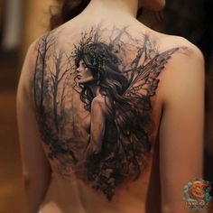 the back of a woman's shoulder with a tattoo design on it, featuring a fairy