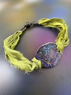 Handmade bohemian-style bracelet featuring upcycled chartreuse sari silk, a hand-enameled bronze plated pewter butterfly charm, and a magnetic clasp.  - Approximately 7 inches. (Need a different size? Include a "Note to Seller" during checkout and we'll make it fit--free of charge!) - Easy-on/easy-off magnetic clasp closure.  -------------------- The textile fabric used to make this bracelet is upcycled from torn and dyed silk that was leftover from the sari manufacturing process. These bracelet Boho Bracelets Stack, Silk Wrap Bracelets, Bracelets Stack, Wrapped Bracelets, Silk Bracelet, Artisan Jewelry Handmade, Dyed Silk, Sari Silk, Silk Dyeing