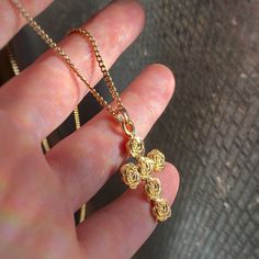 "This is a gold plated cross piece made of roses. It's made of pewter and cast at a production house in Rhode Island and then I hand finish and gold plate it in Toronto, Canada. I only have a couple right now, you can buy it with or without the chain and I can make the chain any length you want. Chain has a long lasting golden plating over stainless steel and has a lobster clasp. All of my plating is good quality and long lasting. Pendant measures approximately 34mm x 16mm Message me with any qu Rose Gold Plated Cross Jewelry, Gold Metal Crucifix Cross Necklace, Gold Metal Cross Pendant Necklace, Gold Metal Cross Necklace As Gift, Gold Rose Pendant Jewelry, Rose Gold Plated Cross Necklace, Gold Elegant Metal Cross Necklace, Gold Rose Design Pendant Jewelry, Elegant Gold Metal Cross Necklace