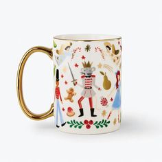 a coffee mug with an image of the nutcrackers and other characters on it