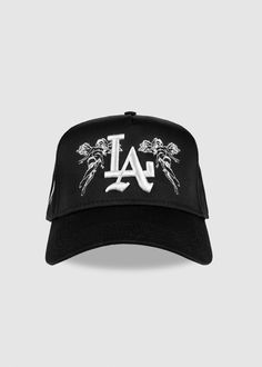 A premium everyday staple item. Featuring a universal 5-panel body along with premium puff embroidery. Details 65% Polyester / 35% Cotton Structured Firm Front Panel 5-panel cap Matching fabric undervisor Adjustable snap - one size fits most Flat embroidered 'Angel" design on front + Signature Slash logo on side panel Puff embroidered 'LA' logo on the front Cool Cap Design, Ny Cap, Streetwear Caps, Braid Styles For Men, Custom Fitted Hats, Puff Embroidery, Streetwear Hats, Dope Hats