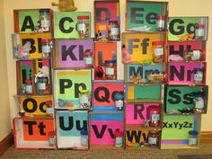 the letters and numbers are made out of different colored cardboard boxes with magnets on them