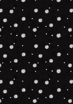 black and white snowflakes are scattered on the dark surface, with small dots