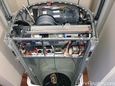 the inside of a large machine with wires and other equipment on it's sides