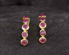 Gold Ruby Earrings set with Natural Ruby in the highest grade, natural patterns & red color, from Burma, at 3mm, 1Ct combined. Gold Bubble Earrings made of Gold Vermeil ☞ thickest 18k Gold Plating on top of Solid 925 Sterling Silver ☞ made to last. Matching Ring: www.etsy.com/uk/listing/862664972 Matching Pendant: www.etsy.com/uk/listing/1005108216 July Birthstone - Genuine & Natural Stones ❀ ⌛ Last pair of earrings left ⌛ For Pierced Ears - has a pin that goes into the ear and a leaver that sec Ruby Earrings Gold, Gold Ruby Earrings, Gold Minimalist Earrings, Red Ruby Earrings, Bubble Earrings, Ruby Earrings Studs, Gold Bubbles, Minimalist Earrings Gold, Natural Patterns