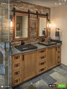 a bathroom with two sinks and mirrors in it