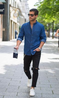 black ripped jeans, a chambray shirt and white sneakers Denim Shirt Black Jeans, Witte Jeans Outfit, Denim Shirt Outfits, Dark Jeans Outfit, Ripped Jeans Look, Dark Denim Shirt, Jeans Outfit Men, Mens Fashion Magazine