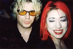 two people with red hair and yellow glasses