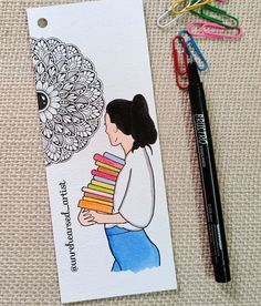 a bookmark with a drawing of a woman holding books next to scissors and markers