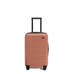 a piece of luggage that is on wheels and has a handle in the middle, with an orange color