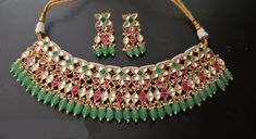 jadau Pachi kundan Bridal choker Necklace set with Earrngs/ Sabyasachi inspired choker/Real pachi kundan Necklace/ Sabyasachi wedding jewelry.Easy to wear, Light in weight & gives you a classy Look. It can be wear in festival occasion with matching salwar or saree. All the raw material used in this product is of high quality and is handcrafted with love. Partywear sabyasachi style Beautiful Bridal Jewelry Set Product Details: Type: Necklace Color: Golden color Size: Adjustable Thread Occasion: F Ceremonial Gold Kundan Choker Necklace, Multicolor Kundan Bridal Choker Necklace, Sabyasachi Choker Necklace, Ceremonial Multicolor Kundan Choker, Traditional Hand-set Kundan Choker, Rajasthani Jewelry, Sabyasachi Wedding, Beautiful Bridal Jewelry, Statement Choker