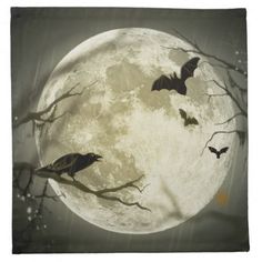 a plate with bats flying in front of a full moon