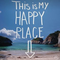 this is my happy place sign with an arrow pointing to the left on a beach