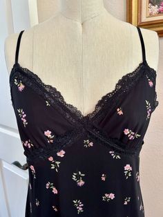 Ready to ship!  NWOT.   Versatile, feminine, comfortable.  Lace bust details.  Adjustable spaghetti straps.  Lettuce hem.  Lining stretches also.  Pair with a denim jacket and flip flops or heels and jewels!   S-T-R-E-T-C-H-Y Size M (medium) Shown on a size 6 dressform. Approx. Measurements: bust: 33 flat, stretches to 40 inches.   waist: 34 flat, stretches to 42 inches.   total length: 46 inches.   Machine Wash Gentle Cold With Like Colors. Non-Chlorine Bleach Only. Line Dry.  About Me: Jillmichelle Artwear Fashion Designer MFA  Wearable art  DM me if you need other design services like alterations and styling, for a separate fee.   I am new to Etsy selling but I have over 250 sales on eBay. References upon request.  Couture bespoke special occasion garments. Emphasizing sourcing, details Black Feminine Sleeveless Camisole, Black Camisole For Spring Loungewear, Black Camisole With Delicate Straps For Spring, Black Camisole Dress With Delicate Straps, Floral Print Fitted Camisole For Brunch, Black Casual Camisole Slip Dress, Black Slip Dress With Delicate Straps For Summer, Spring Cami Black Slip Dress, Spring Black Cami Slip Dress