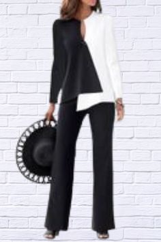 Elevate your style with our sophisticated Black and White Color Blocking Long Sleeve Top and Long Pants Two-piece Set. This chic ensemble is designed to offer both comfort and elegance, making it a perfect addition to your wardrobe for any occasion. Key Features: Color Blocking Design: The striking black and white color blocking creates a bold and modern look that’s sure to turn heads. Two-piece Set: Includes a long sleeve top and matching long pants for a coordinated and polished outfit. Fabric Softness: Enjoy moderate softness for a comfortable fit throughout the day. Non-Stretch Fabric: Designed with non-stretch fabric to provide a structured and tailored look. Fabric Thickness: Thin fabric ensures breathability and comfort, making it ideal for year-round wear. Fit Type: Standard fit of Chic Stretch Office Sets, Elegant Long Sleeve Pant Set For Fall, Chic Two-piece Set, Elegant Two-piece Stretch Set, Chic Two-piece Pants For Fall, Chic Two-piece Fall Pants, Chic Two-piece Pants Set For Work, Elegant Two-piece Set For Workwear, Two-piece Pant Set For Workwear