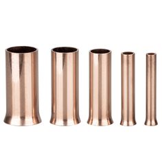 four different sizes of copper tubes on a white background