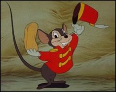 a cartoon mouse in a red uniform holding a banana