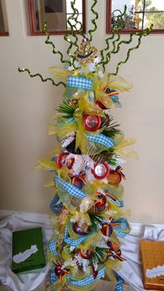 a decorated christmas tree in the corner of a room