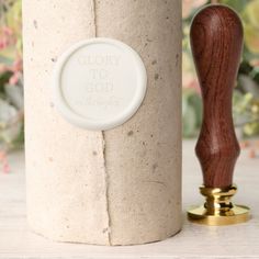 a close up of a bottle with a wooden stopper