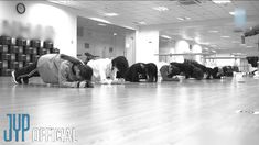 several people laying on the floor in an office