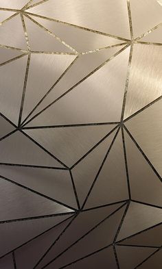 a close up view of a metal surface with lines and dots on it, as well as an abstract design