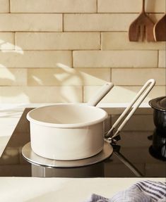 a white bowl sitting on top of a stove