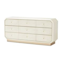 a white dresser with four drawers and two doors