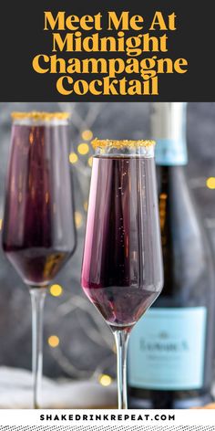 two wine glasses filled with red and purple liquid next to bottles of champagne on a table