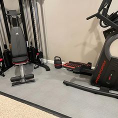 there is a gym with exercise equipment on the floor