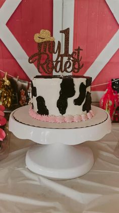 a black and white cake sitting on top of a table