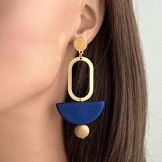 "Big Bold Statement Earrings, Minimalist style earrings, Matte Gold Earrings Ultra modern earrings, clean cut design to complement any outfit. Very Light weight. Materials: Gold plated brass, Rubberized acrylic bead. Size: Style A 2.6\" long, Style B 3\" long Your purchase comes in a beautiful box that is ready to give as a gift or to keep for yourself. **Want a custom design? Just ask! The custom made jewelry is sure to make the owner feel like a super star. We love mixing finishes. **Please be Modern Earrings Gold, Geometric Earrings Minimalist, Modern Blue Earrings For Everyday, Modern Blue Earrings For Everyday Wear, Modern Blue Metal Earrings, Modern Blue Everyday Earrings, Minimalist Blue Everyday Earrings, Modern Linear Drop Earrings For Jewelry Making, Blue Metal Earrings For Everyday Wear