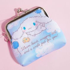 a small purse with an image of a sheep on it