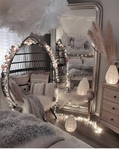 a bedroom decorated with lights and feathers