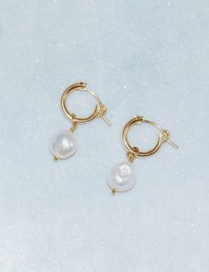 These classy and classic pearl hoop earrings are made using 14k gold fill, so they are safe for sensitive ears. -- Details -- 14k gold fill, pearl charm 12mm 14k gold fill hoops Each piece is handmade with love in my studio in sunny Marina Del Rey, CA.