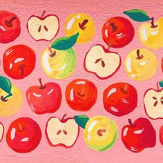 an image of apples with faces painted on the outside and in red, yellow and green