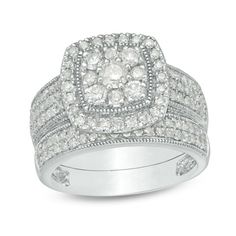 Give her a radiant symbol of your affection with this dazzling vintage-inspired diamond bridal set. Crafted in cool 10K white gold, the glamorous engagement ring features a 1/6 ct. diamond centered in a cushion-shaped composite of round diamonds. The frame sparkles with diamonds and intricate milgrain detailing. Along the shank, milgrain borders highlight a trio of diamond-lined ribbons. The perfect complement, the milgrain-lined wedding band shimmers with two rows of diamonds. Captivating with Glamorous Engagement Rings, Enhancer Wedding Band, Diamond Frame, Peoples Jewellers, Bridal Engagement Rings, Diamond Bridal Sets, Cushion Diamond, Hrithik Roshan, Bridal Set