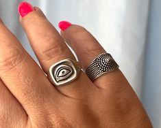 Part of our women's ring collection, the Evil Eye ring and the Dotted Chevalier ring are the perfect addition to your new season wardrobe.  The Dotted Chevalier ring features dots detailing. It's cast from polished silver-plated pewter and hollowed out for a lightweight feel.  With an open eye engraved, the Evil Eye ring is famous for its protective powers. Slightly adjustable rings are also, available in 24k gold plated. These rings are perfect to wear all day with all your outfits.  Please sel Adjustable Symbolic Metal Rings, Symbolic Adjustable Toe Ring, Symbolic Adjustable Midi Rings, Symbolic Adjustable Open Midi Rings, Adjustable Symbolic Open Midi Rings, Symbolic Adjustable Stackable Open Rings, Symbolic Open Ring In Metal, Silver Statement Rings, Symbolic Handmade Metal Rings