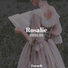 a woman in a dress reading a book with the words roslie beautiful rose