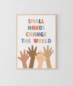 an art print with colorful hands saying small hands change the world