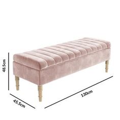 a pink bench with wooden legs and measurements