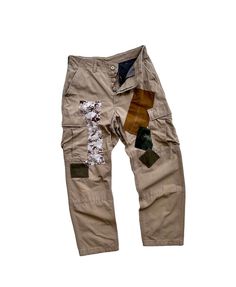 "Description: Uniqueness is here for those who love‼️ It's original army pants, cargo style, double knees, in plain khaki which several military patterns (Camouflage, Desert, Marine, Soldier) were patched as photos shown. It's is a reworked pair of pants in order to make it unique and perfect combination.  Photos and videos describe the product better. So, just have a look-see at them all and read the special features below before you decide to purchase it.  Features: - Patchwork army pants. -  Different military patterns were patched throughout the pants. - Unique design detailing.  - Cargo pants with multi-pockets. - Double knees. - Regular fit. Size: Waist: 31\" (Round) Hips:  40\" (Round) Length: 40.5\" Tight: 26\" (Round) Leg opening: 16\" (Round) Condition: Used and reworked. Gender: Marine Soldier, Military Desert, Camo Pant, Pants Unique, Military Pattern, Army Pants, Cargo Khaki, Pants Cargo, Vintage Patchwork