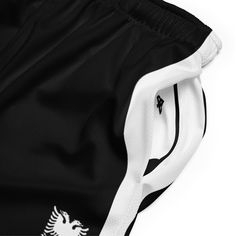 Discover the epitome of court-ready style with our Mesh Shorts, designed to perfectly complement your Albanian Basketball and Football jerseys. These shorts boast a sleek base adorned with crisp stripes along the sides. Crafted to cater to the preferences of Albanians worldwide seeking authentic Albanian products, these shorts seamlessly blend comfort, individuality, and Albanian pride for an unmatched presence on and off the court. White Shorts With Side Stripes, White Bottoms With Side Stripes, White Short Bottoms With Side Stripes, Black Shorts With Side Stripes, Classic Sports Bottoms, Eagle Icon, Double Headed Eagle, Cultural Identity, Recycled Polyester Fabric